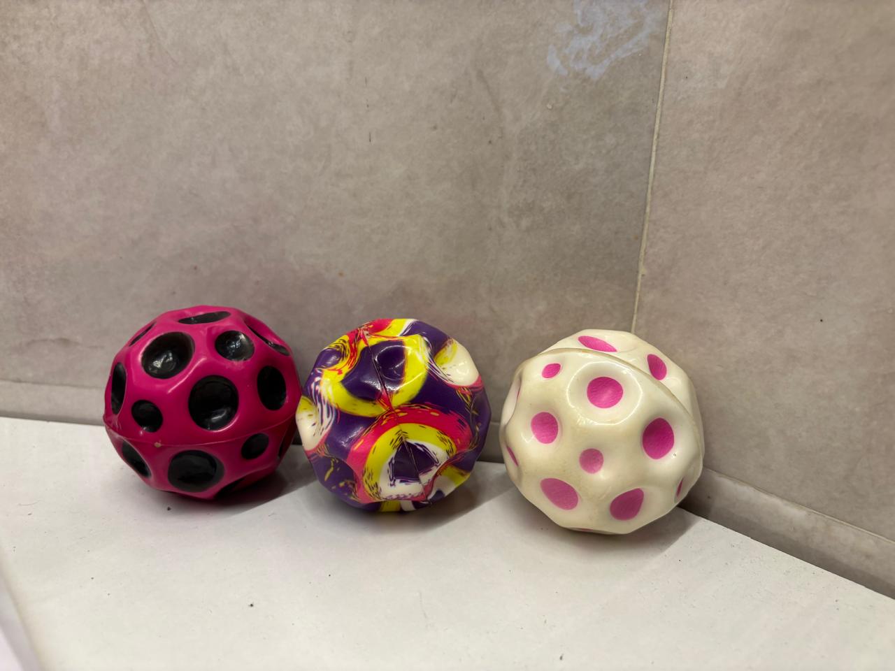 Three moon balls lined up